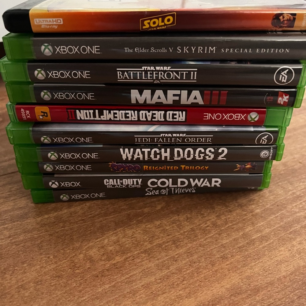 Xbox one s with 3 controllers and 9 games.